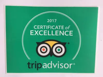 a sign that reads certificate of excellence sqor advisor at Ocean Blue in Miami Beach