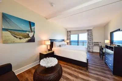 a hotel room with a bed and a television at Sun Tower Hotel & Suites on the Beach in Fort Lauderdale