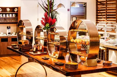 a bakery with a display of bread and pastries at InterContinental Miami by IHG in Miami