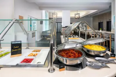 a buffet line with many different types of food at Staybridge Suites Miami Doral Area by IHG in Miami
