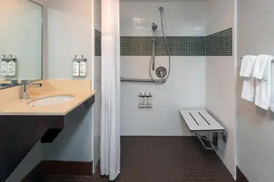 a bathroom with a sink and a shower at Staybridge Suites Miami Doral Area by IHG in Miami