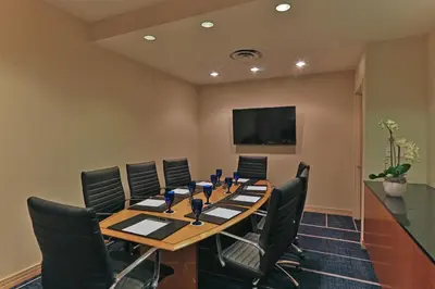 a conference room with a long table and chairs at InterContinental At Doral Miami by IHG in Miami