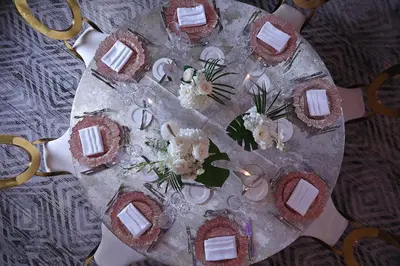 a table with a plate of food and flowers on it at InterContinental At Doral Miami by IHG in Miami