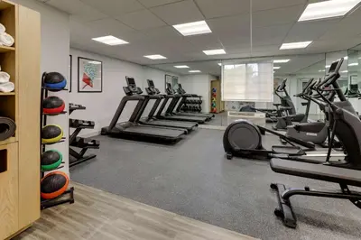 a gym with treadmills and elliptical machines at Sonesta Simply Suites Miami Airport Doral in Miami