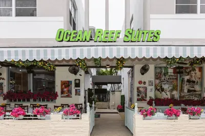 a store front of a flower shop with pink flowers at Ocean Reef Suites in Miami Beach