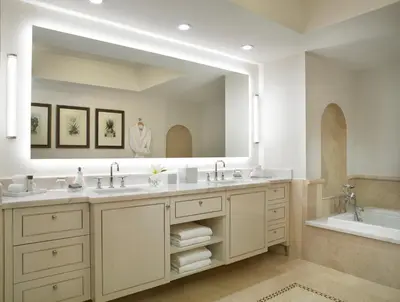 a bathroom with two sinks and a large mirror at Acqualina Resort and Residences in Miami Beach