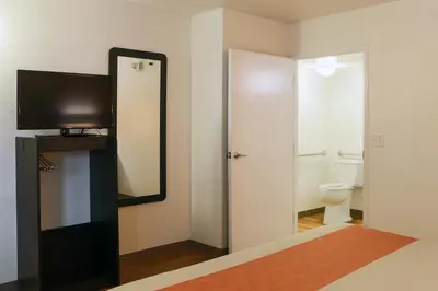 a bathroom with a mirror and a toilet at Motel 6-Cutler Bay, FL in Cutler Bay