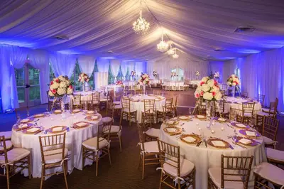 a wedding reception in a marquee with white tables and chairs at DoubleTree Resort Hollywood Beach in Hollywood