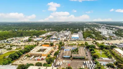 an aerial view of a parking lot in a city at Rodeway Inn & Suites Fort Lauderdale Airport & Cruise Port in Fort Lauderdale