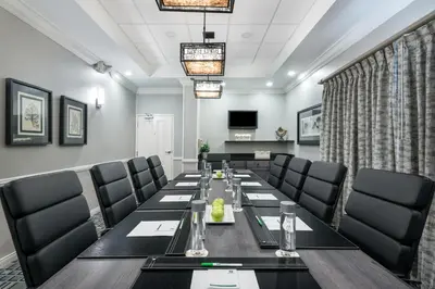 a conference room with a long table and chairs at Holiday Inn Fort Lauderdale Airport by IHG in Hollywood
