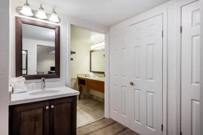 a bathroom with a sink and a mirror at Holiday Inn Fort Lauderdale Airport by IHG in Hollywood