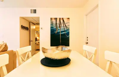 a dining room with a bowl on a table at Villa Venezia in Fort Lauderdale