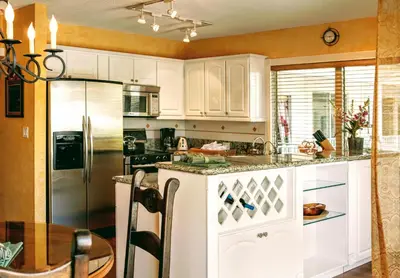 a kitchen with white cabinets and a counter top at Villa Venezia in Fort Lauderdale