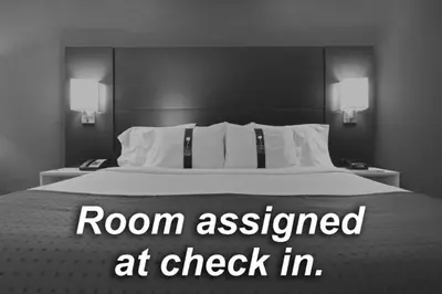 a bedroom with a bed with a room assessed at check in at Holiday Inn Express Hotel & Suites Fort Lauderdale Airport/Cruise Port by IHG in Fort Lauderdale