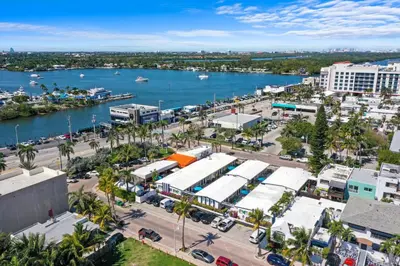 an aerial view of a city with a body of water at Hollywood Beach Suites and Hotel in Hollywood