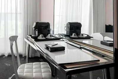 a glass table with two hair dryers on top of it at Dua Miami, Autograph Collection in Miami