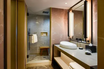 a bathroom with a sink and a shower at Nobu Hotel Miami Beach in Miami Beach