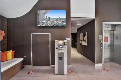 a room with a television on the wall and a machine at Modern Penthouse condo with 2 Large private terraces in Hollywood