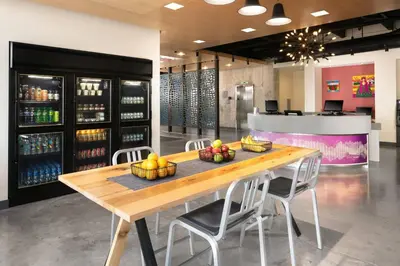 a table with fruit on it in a wine store at Aloft Miami Airport in Miami