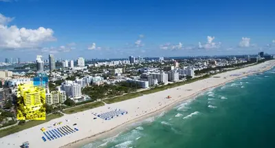 an aerial view of a beach and the ocean at Beachfront Bentley Hotel One Bedroom Suite with Balcony and Beach access in Miami Beach