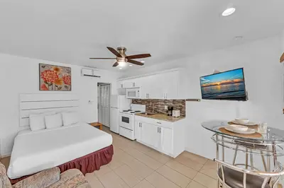 a living room with a bed and a kitchen at The Sunrise in Hollywood