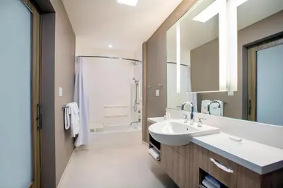 a bathroom with a sink and a shower at SpringHill Suites by Marriott Miami Doral in Miami