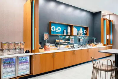 a fast food restaurant with a counter with food at SpringHill Suites by Marriott Miami Doral in Miami
