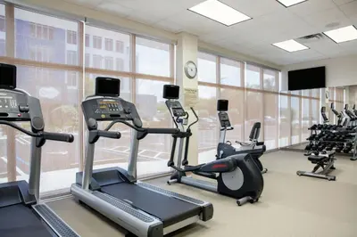 a gym with treadmills and elliptical machines at SpringHill Suites by Marriott Miami Doral in Miami