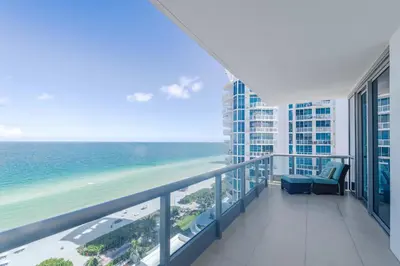 a balcony with a view of the ocean at Bluebird Suites Monte Carlo Miami Beach in Miami Beach