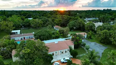 an aerial view of a house with trees at La Finca in Miami