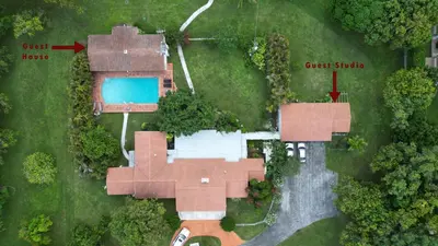an aerial view of a house with a pool at La Finca in Miami