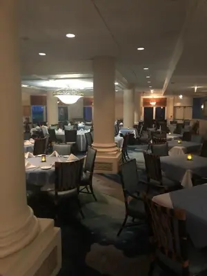 a dining room with tables and chairs in a restaurant at The Lago Mar Beach Resort and Club in Fort Lauderdale
