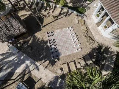 an overhead view of a tile yard with palm trees at The Lago Mar Beach Resort and Club in Fort Lauderdale