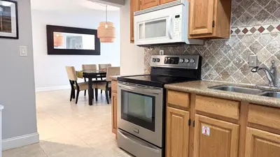 a kitchen with a sink and a stove top oven at The Tides 1bedroom apt 3rd floor We are on the Beach! in Hollywood