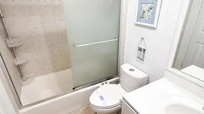 a small bathroom with a toilet and a shower at The Tides 1bedroom apt 3rd floor We are on the Beach! in Hollywood