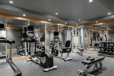 a gym with several treadmills and cardio machines at Residence Inn by Marriott Miami Aventura Mall in Aventura