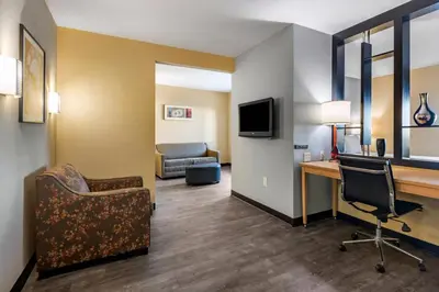 a hotel room with a desk and a chair and a computer at Cambria Hotel Ft Lauderdale, Airport South & Cruise Port in Dania Beach