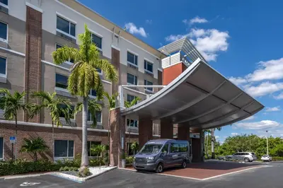 a van parked in front of a building at Cambria Hotel Ft Lauderdale, Airport South & Cruise Port in Dania Beach