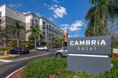 a sign for a hotel in front of a building at Cambria Hotel Ft Lauderdale, Airport South & Cruise Port in Dania Beach