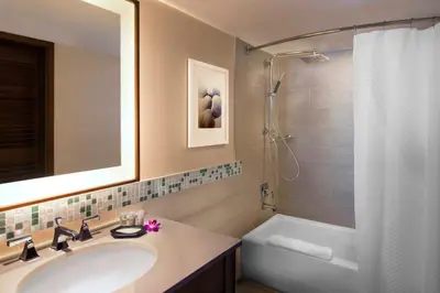 a bathroom with a sink and a shower and a tub at The Westin Fort Lauderdale Beach Resort in Fort Lauderdale