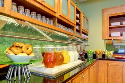a kitchen with a counter with a bowl of food at Hyatt Place Fort Lauderdale Airport/Cruise Port in Dania Beach