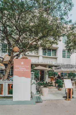 a sign in front of a building at Iberostar Waves Berkeley Shore in Miami Beach