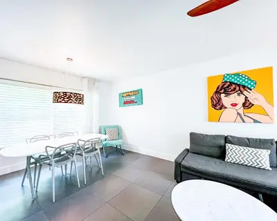 a living room with a couch and a table at Royal Palms Resort & Spa in Fort Lauderdale