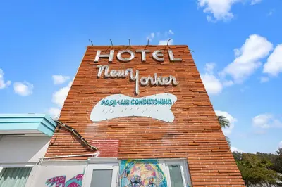 a sign on the side of a hotel motel at The New Yorker Hotel Miami in Miami