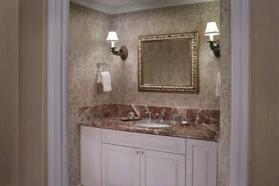 a bathroom with a sink and a mirror at The Ritz-Carlton Coconut Grove, Miami in Miami