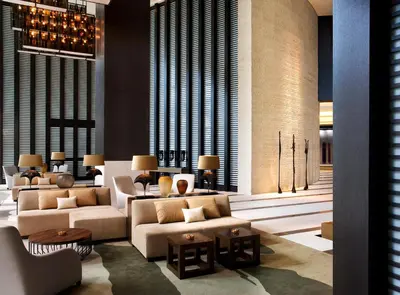 a lobby with couches and tables in a building at Kimpton EPIC Hotel by IHG in Miami