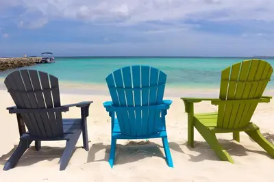 two chairs and a table on the beach at Apartment On The Beach in Miami Beach