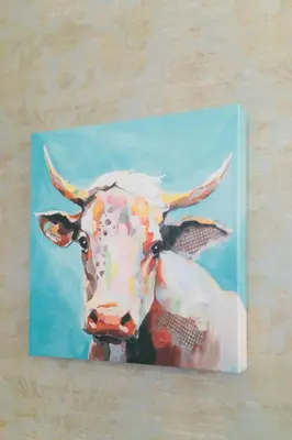 a painting of a cow on a wall at Apartment On The Beach in Miami Beach