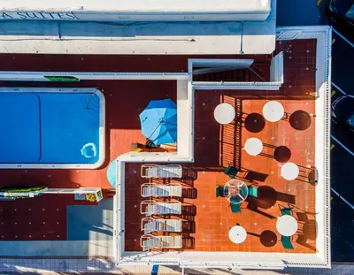 an overhead view of a building with a blue umbrella at Pousada Suites at Hollywood Beach in Hollywood