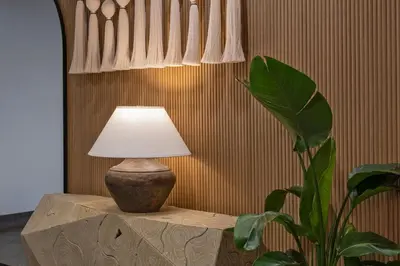 a lamp sitting on a table next to a plant at Residence Inn Miami Sunny Isles Beach in Miami Beach